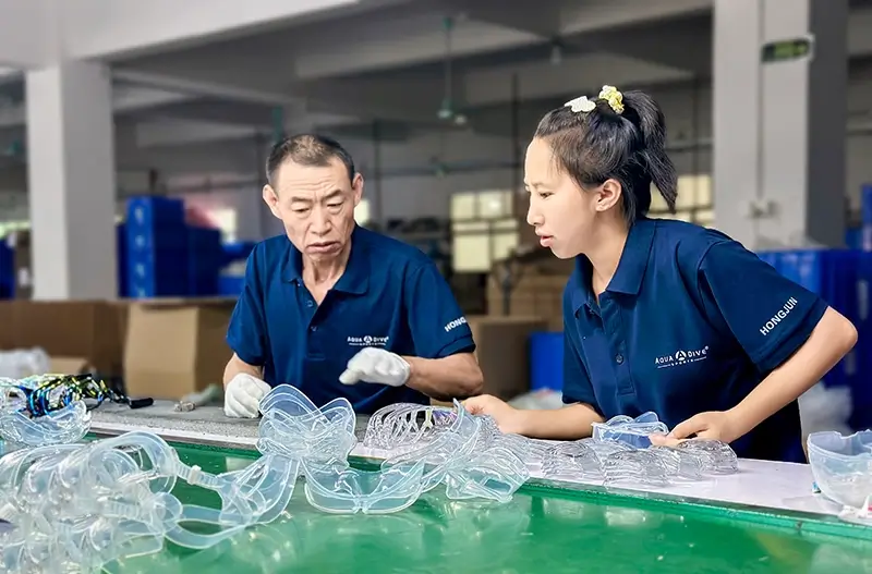 Two Aquadive Diving Mask Factory Worker